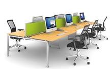 6 Person Bench Desk With Wooden Top And Mesh Chairs And Monitor Screens